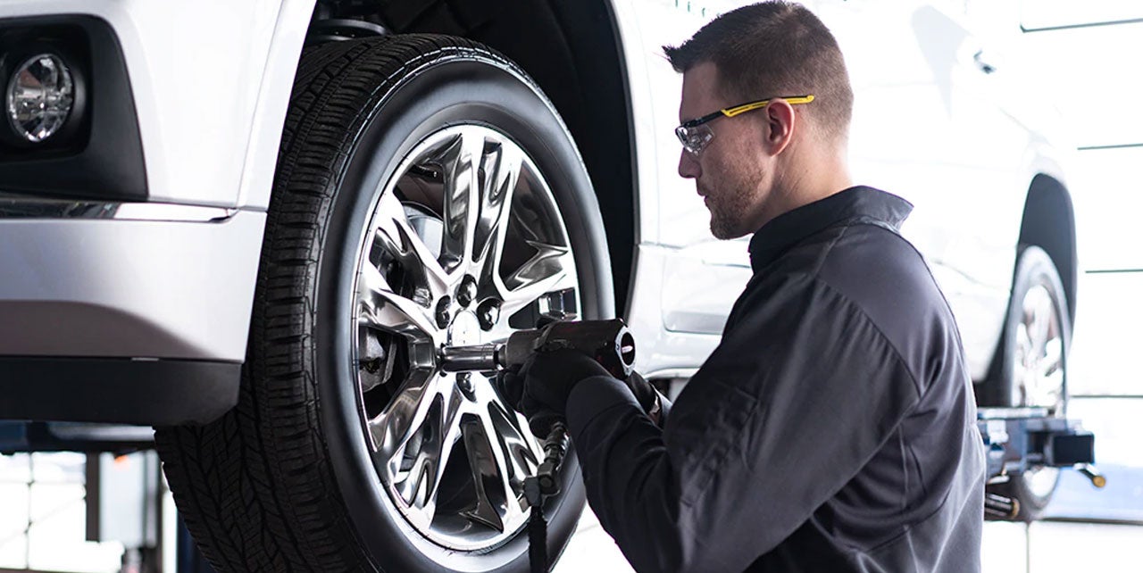 Mechanic working on a car wheel